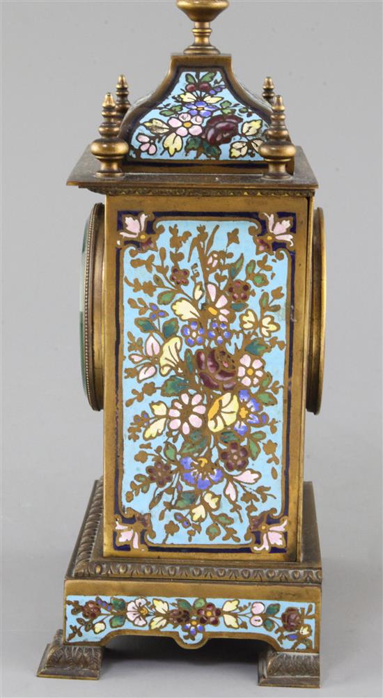 An early 20th century bronze and champleve enamel clock garniture, 8in.